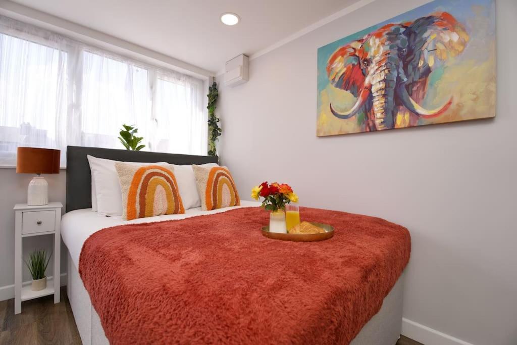 a bedroom with a large bed with a red blanket at Dane Duplex Studio Four - Stunning Coventry Oasis in Coventry