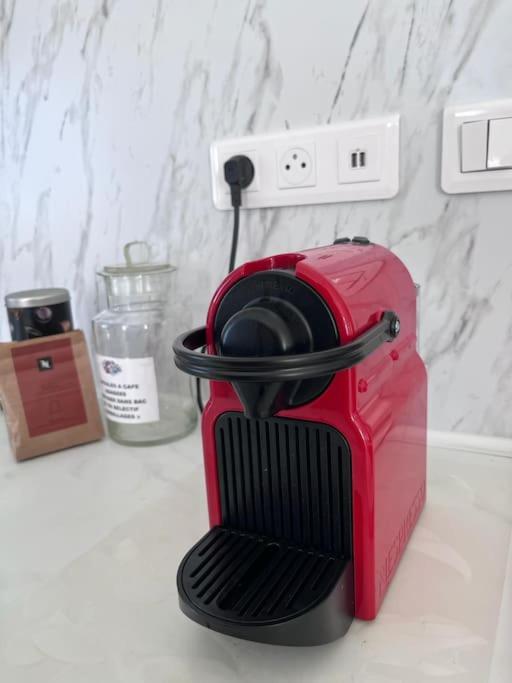 a red toaster sitting on top of a counter at Sabot de Vénus YourHostHelper in Annecy