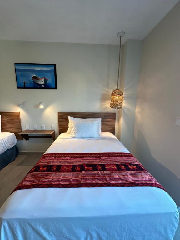 Postel nebo postele na pokoji v ubytování Oneiro Suites with Sea View