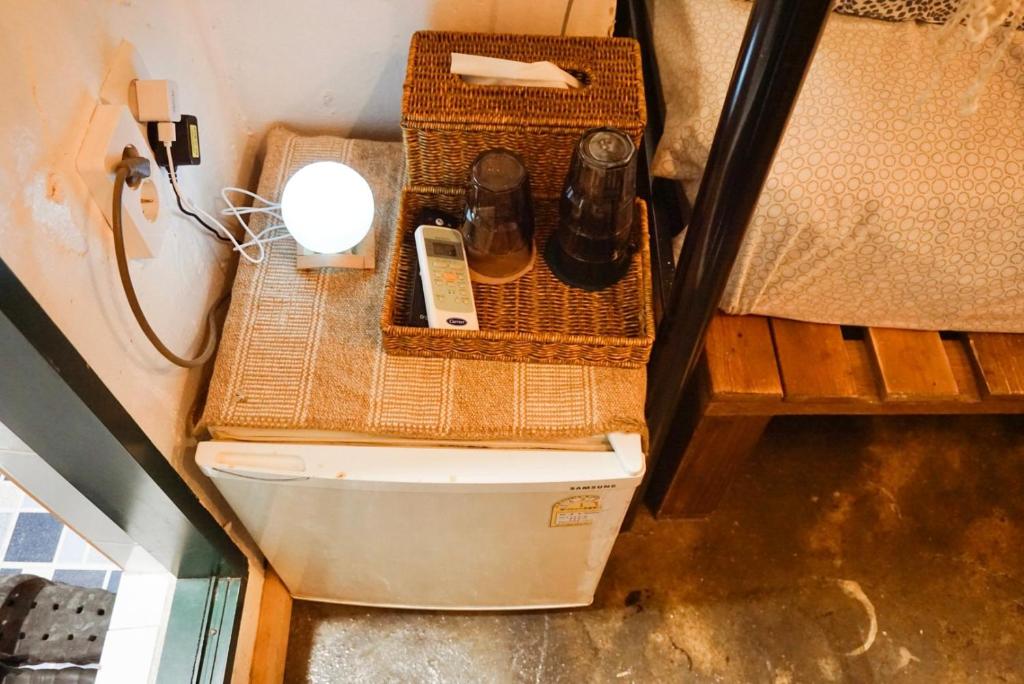 a toilet in a room with wicker baskets at Space ARA in Seoul