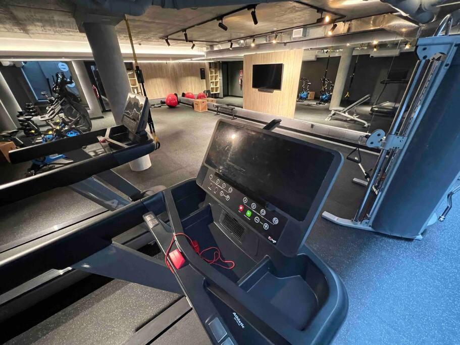 a gym with a treadmill and a simulator at More Echevarriarza apartamento de estreno!! in Montevideo