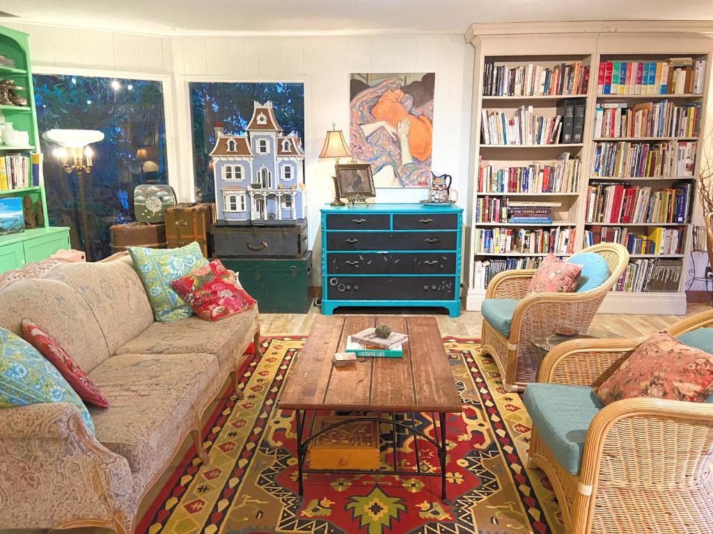 a living room with a couch and a coffee table at Wisteria Guest House in Ganges