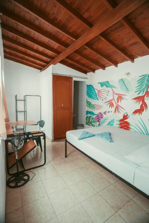 Postel nebo postele na pokoji v ubytování Hostal Pura Vida la 70