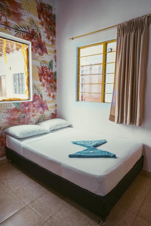 Postel nebo postele na pokoji v ubytování Hostal Pura Vida la 70