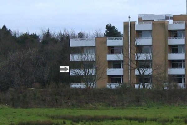 an apartment building with a field in front of it at Apartment 214 im Haus Frauenpreiss in Sahlenburg