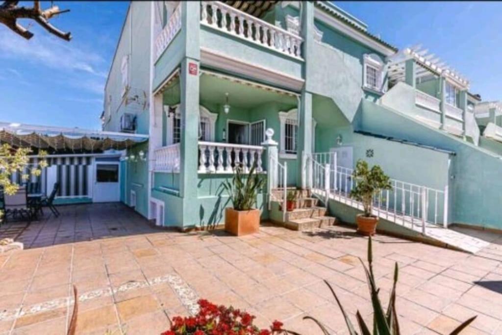 a house with a patio in front of it at Bungalow adaptado, terraza muy grande y soleada. in Gran Alacant