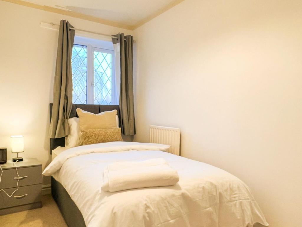 Un pat sau paturi într-o cameră la Vista Lodge