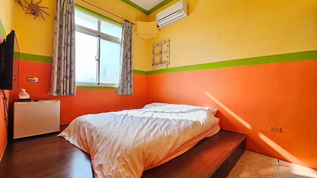 Postel nebo postele na pokoji v ubytování Sea Front Homestay