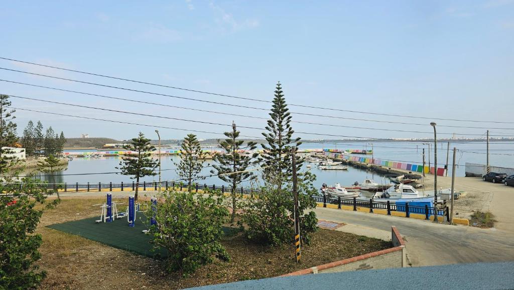 a view of a marina with boats in the water at Sea Front Homestay in Magong