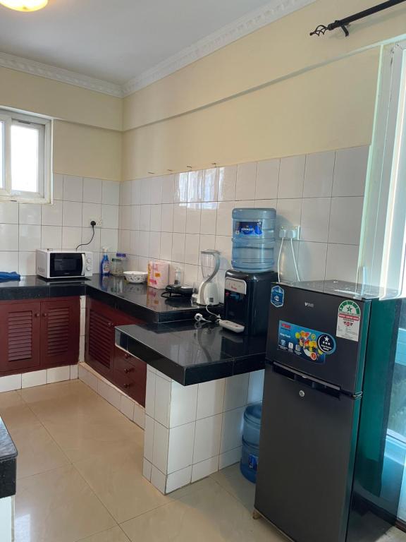Kuchyň nebo kuchyňský kout v ubytování Sunrise Apartments-Nyali