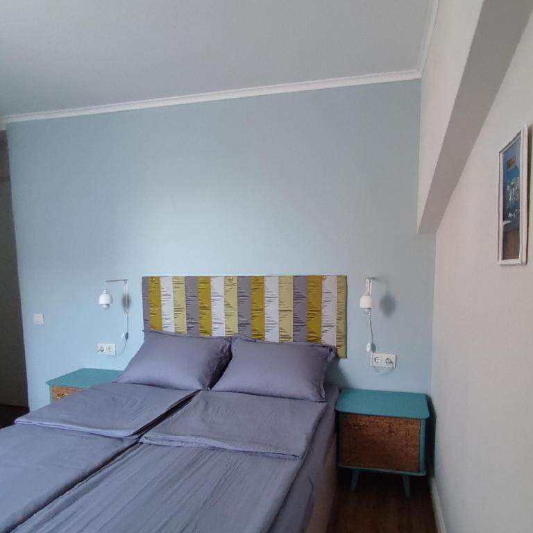 Postel nebo postele na pokoji v ubytování 9 Doors