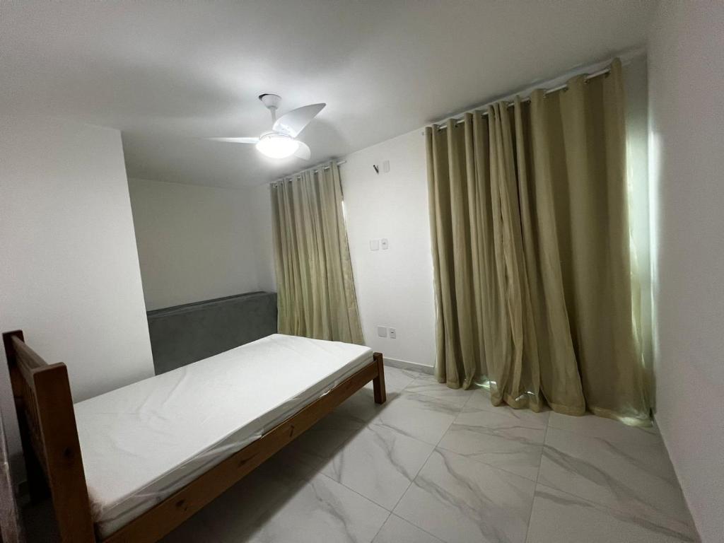 מיטה או מיטות בחדר ב-Casa em Cabo Frio