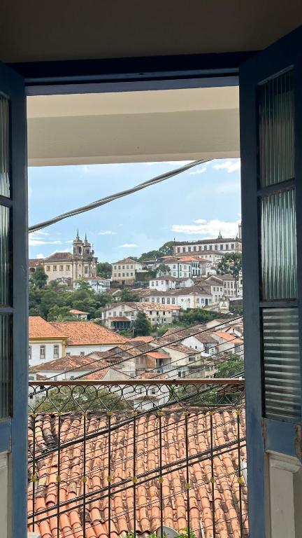 a view of a city from a window at Escadaria Vila Rica Pousada & Hostel in Ouro Preto