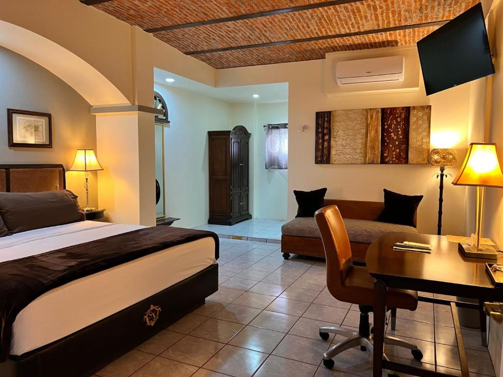Postel nebo postele na pokoji v ubytování Hotel & Eventos Xalos