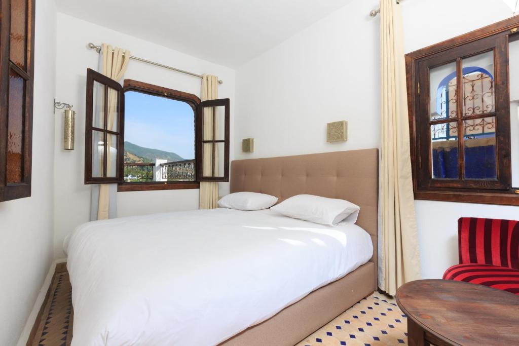 Postel nebo postele na pokoji v ubytování Riad Zaitouna Chaouen