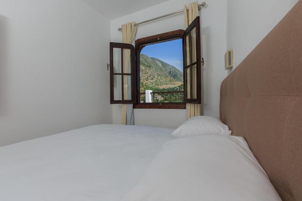 Postel nebo postele na pokoji v ubytování Riad Zaitouna Chaouen