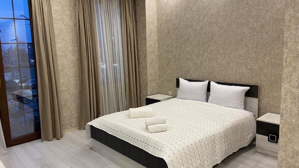 Postel nebo postele na pokoji v ubytování Astoria Hotel