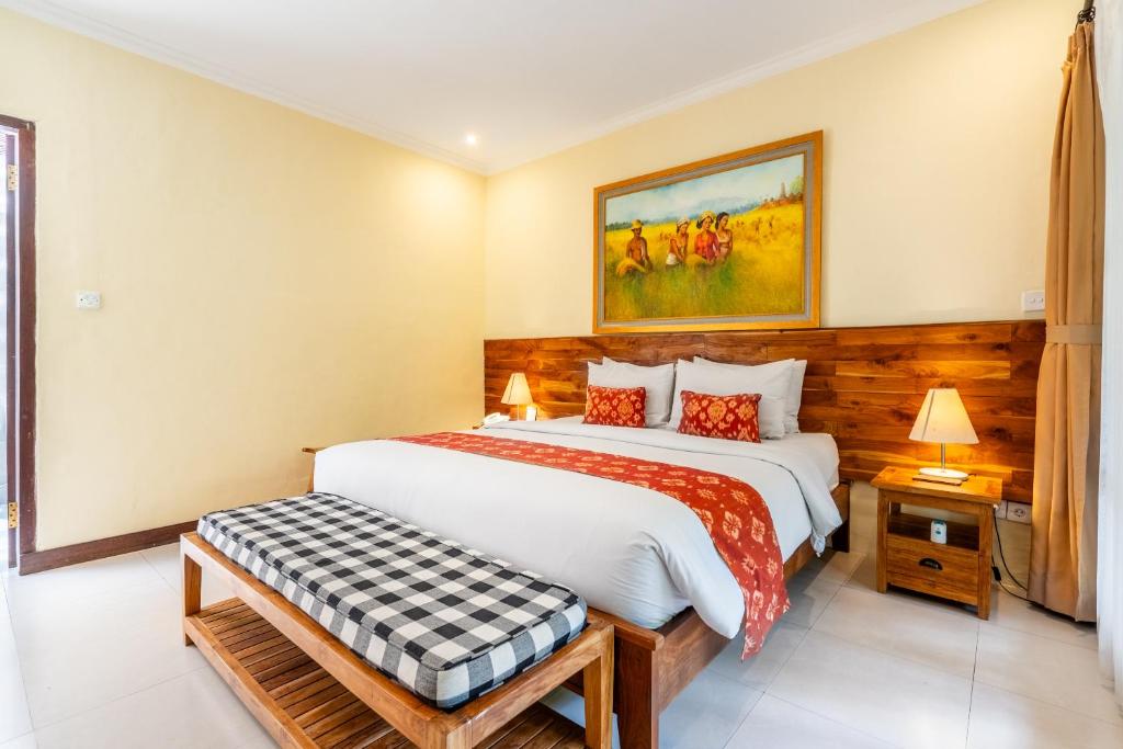 Postel nebo postele na pokoji v ubytování Meruhdani Boutique Hotel Ubud