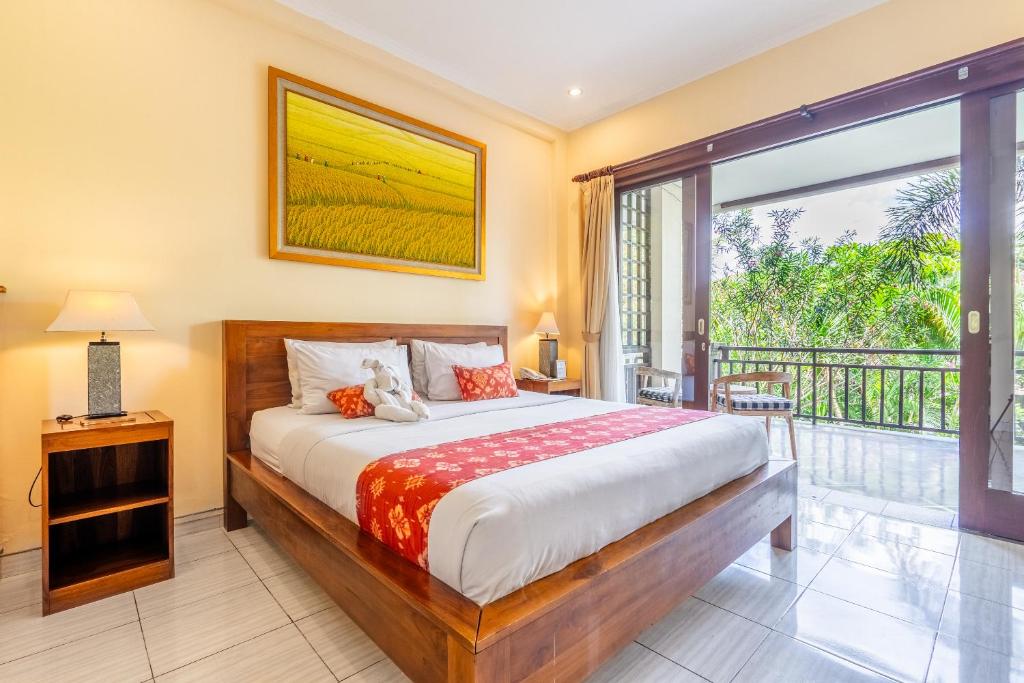 Postel nebo postele na pokoji v ubytování Meruhdani Boutique Hotel Ubud