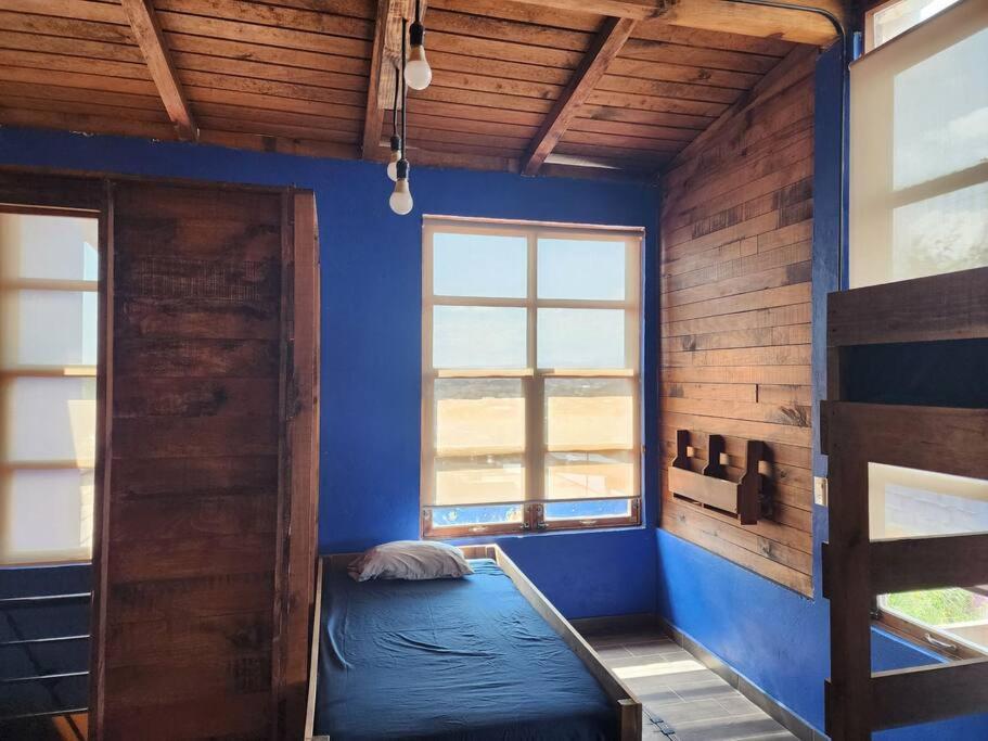 Postel nebo postele na pokoji v ubytování Casa azul
