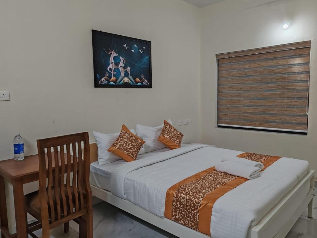 Postel nebo postele na pokoji v ubytování Greenview Royal Stay Near Amrita Hospital Edappally