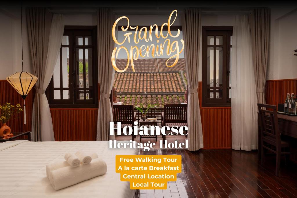 um cartaz de um quarto de hotel com uma cama e uma placa em Hoianese Heritage Hotel - Truly Hoi An em Hoi An