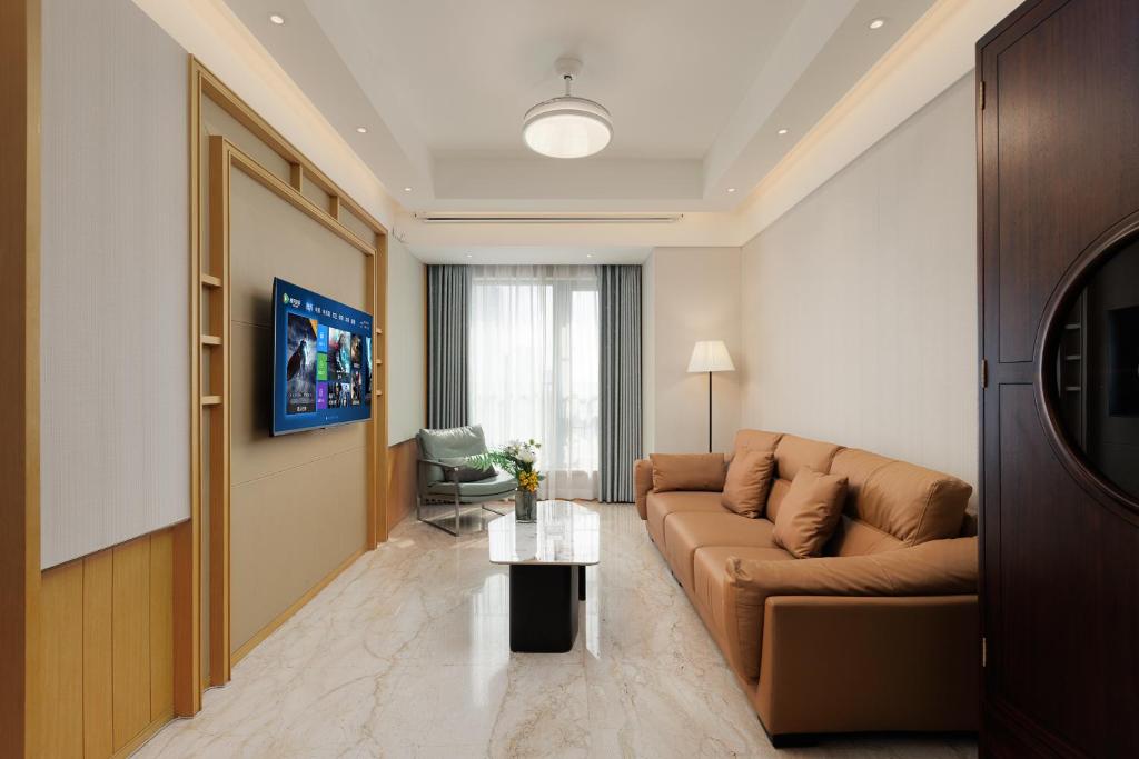 TV a/nebo společenská místnost v ubytování Doria Home International Apartment -Guangzhou Huijin IFC Keyun Road Metro Branch-Canton Fair Free Shuttle