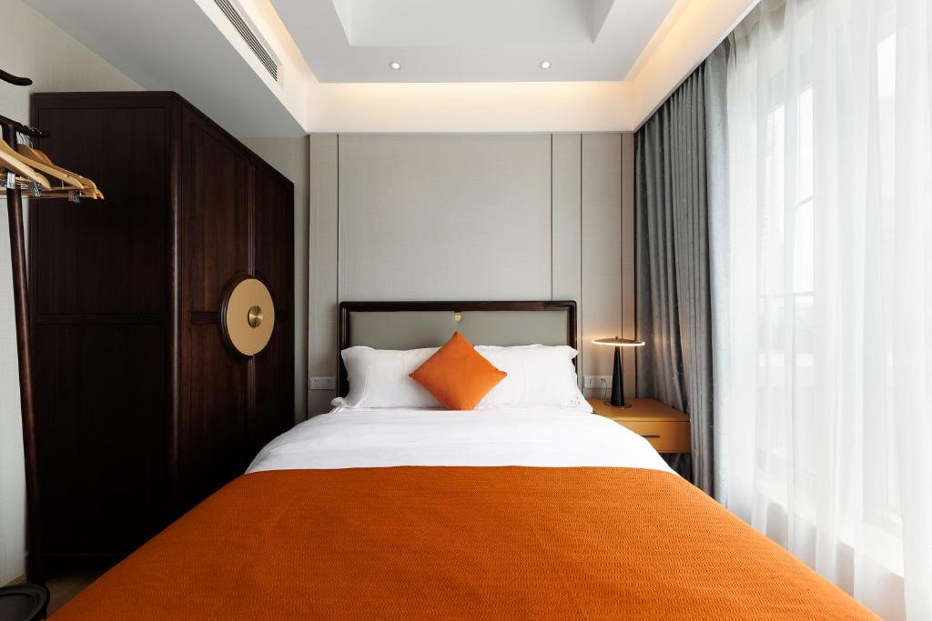 Postel nebo postele na pokoji v ubytování Doria Home International Apartment -Guangzhou Huijin IFC Keyun Road Metro Branch-Canton Fair Free Shuttle