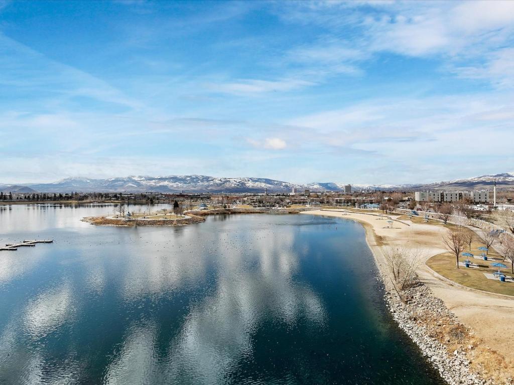 an aerial view of a body of water with mountains at Exquisite Lakefront Condo in Sparks