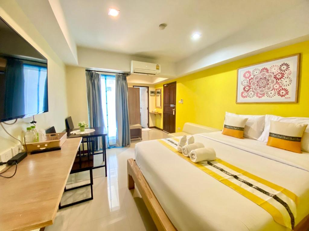 Ένα ή περισσότερα κρεβάτια σε δωμάτιο στο Chinda Boutique Hotel
