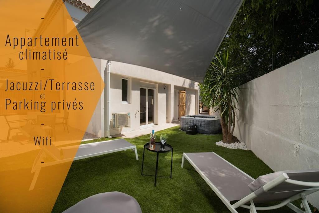 une image d'une chambre avec une cour avec de l'herbe verte dans l'établissement Le Yucca - Jacuzzi Jardin Clim Wifi Parking, à Marseille