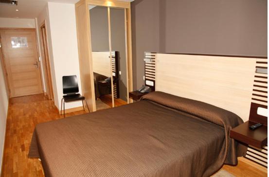 Postel nebo postele na pokoji v ubytování Hotel Restaurante Zelaa