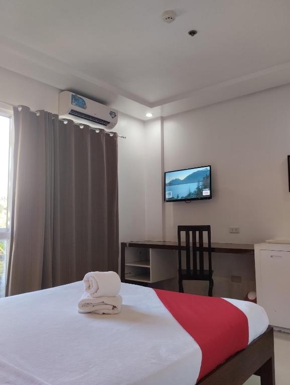 Postel nebo postele na pokoji v ubytování Royale Parc Hotel Puerto Princesa Palawan