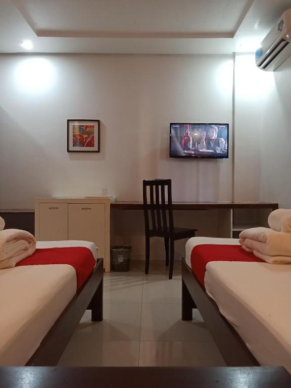 Postel nebo postele na pokoji v ubytování Royale Parc Hotel Puerto Princesa Palawan