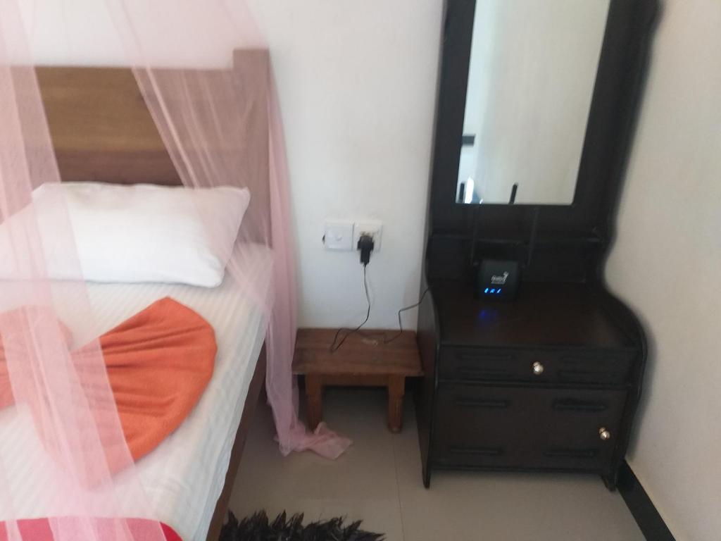 Postel nebo postele na pokoji v ubytování Nine Arch Araliya Homestay