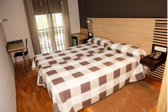 Postel nebo postele na pokoji v ubytování Hotel Restaurante Zelaa