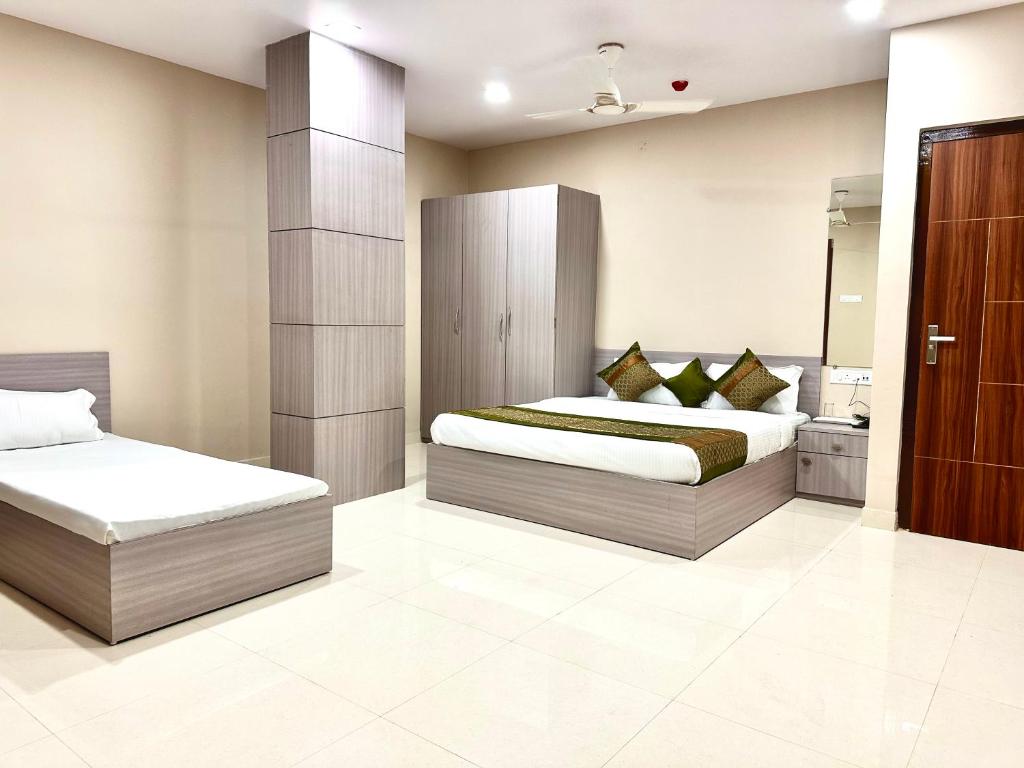Ένα ή περισσότερα κρεβάτια σε δωμάτιο στο SASA INN