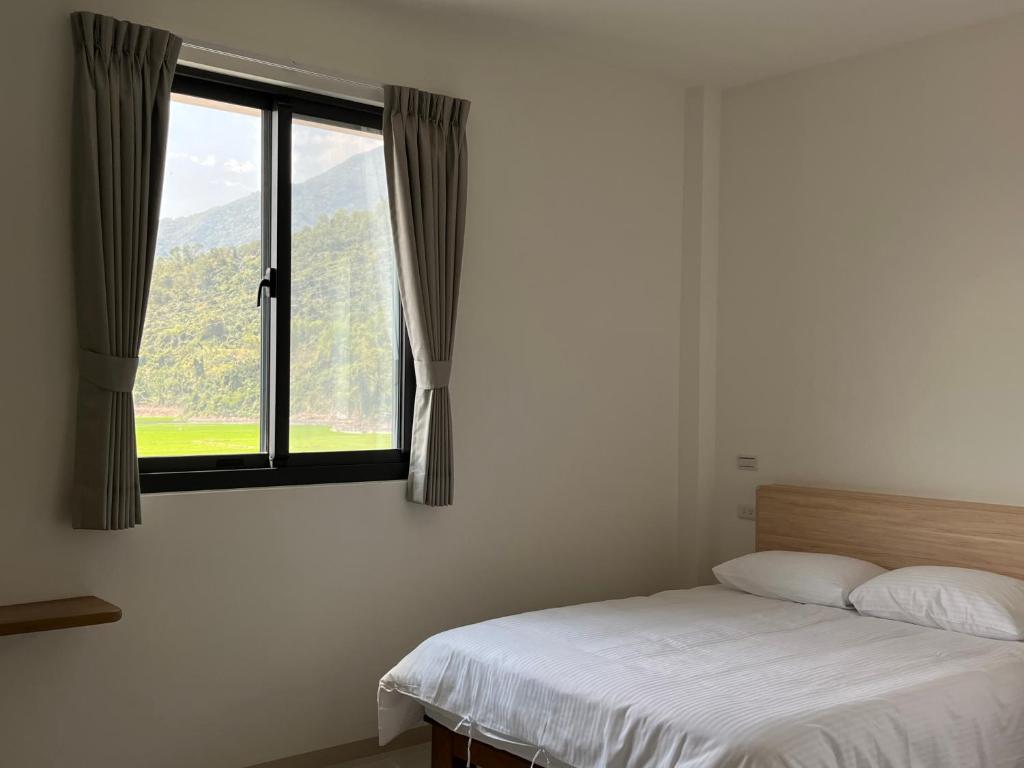 Postel nebo postele na pokoji v ubytování 楠山民宿Nanshan Homestay