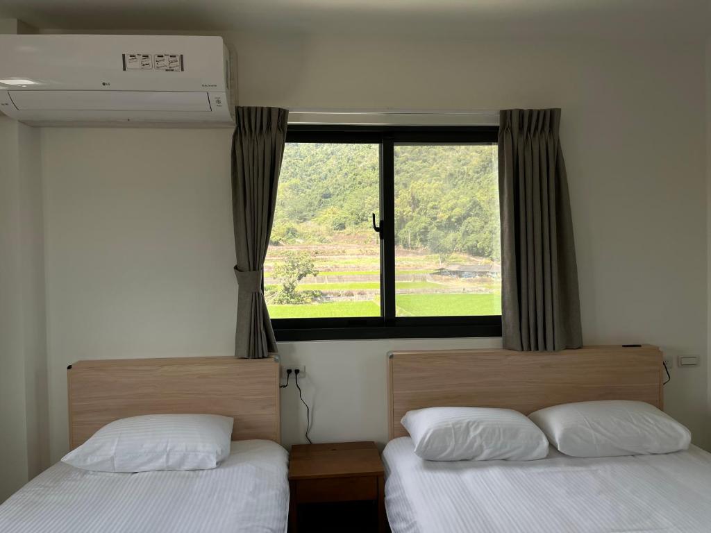 Postel nebo postele na pokoji v ubytování 楠山民宿Nanshan Homestay