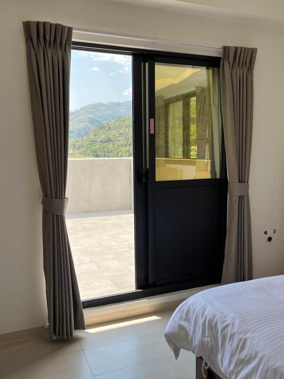 Postel nebo postele na pokoji v ubytování 楠山民宿Nanshan Homestay