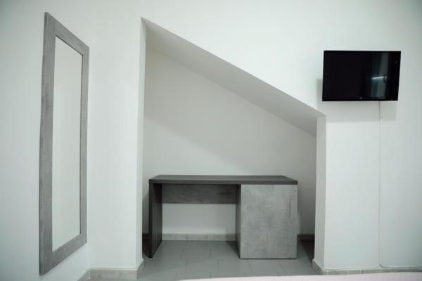 A television and/or entertainment centre at BlueBay Residence Resort