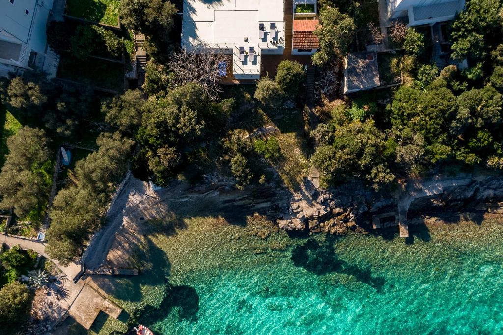 an aerial view of a beach with turquoise water at Seafront House on Island Korčula in Korčula