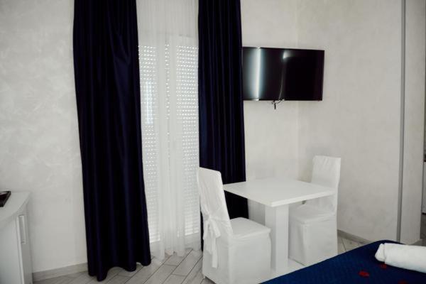 A television and/or entertainment centre at BlueBay Residence Resort