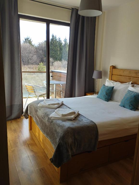 Postel nebo postele na pokoji v ubytování Chamkoria Chalets