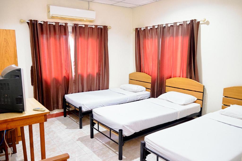 Postel nebo postele na pokoji v ubytování Toon Guesthouse