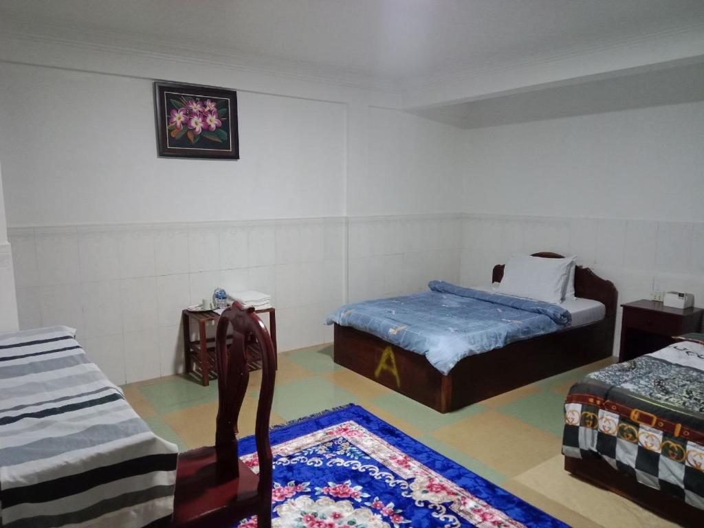 Postel nebo postele na pokoji v ubytování Centro Guest House