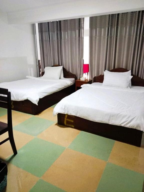 Postel nebo postele na pokoji v ubytování Centro Guest House