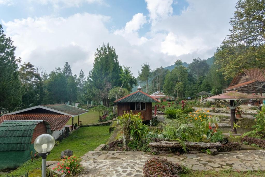a garden at a resort in the mountains at Hilltop Camp by TwoSpaces, Lembang in Lembang