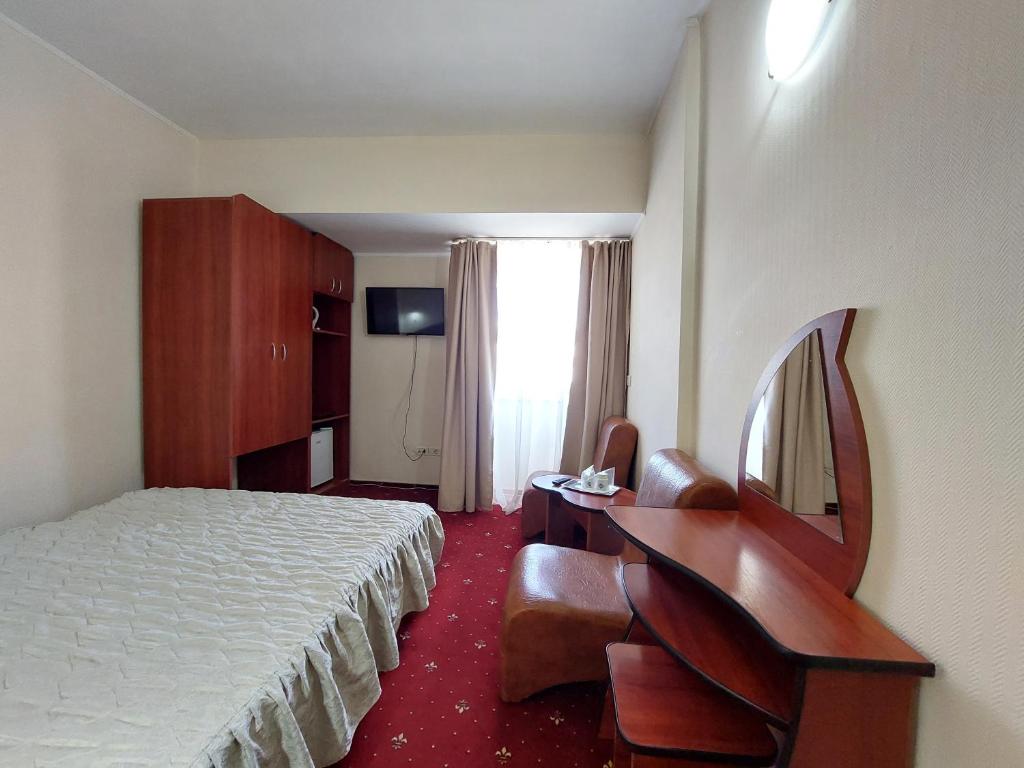 Postel nebo postele na pokoji v ubytování Hotel Egreta