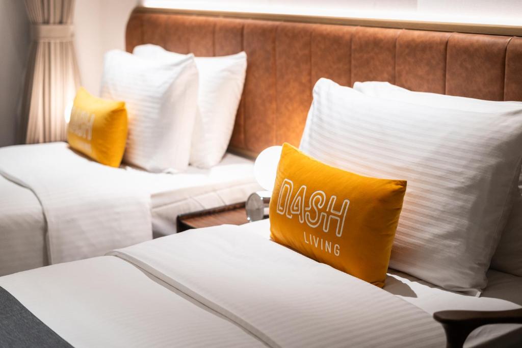 Uma cama ou camas num quarto em Dash Living on Hollywood